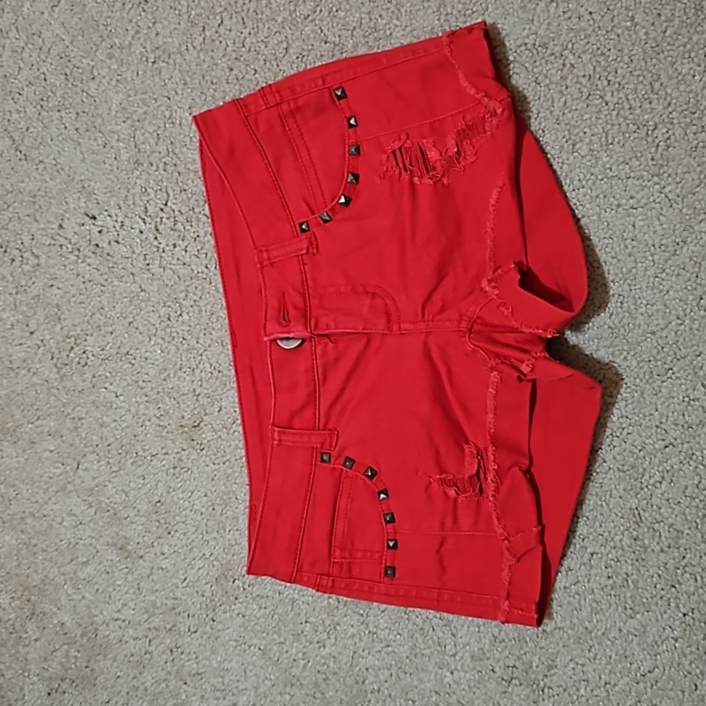 Bright red distressed shorts
